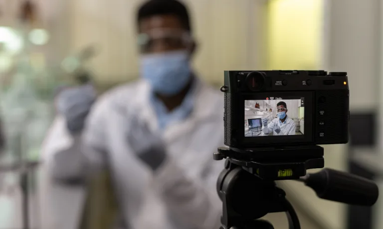 Scientist recording a video in the lab